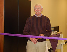 Brian Timney cutting the ribbon